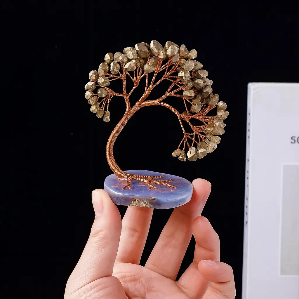 Hand holding a pyrite tree 